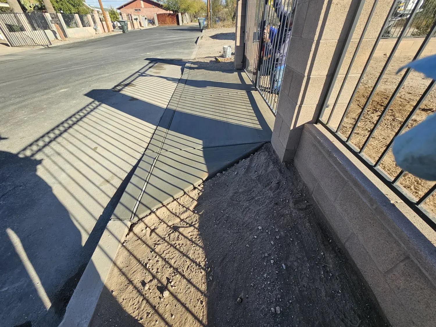 Concrete driveway with iron fencing