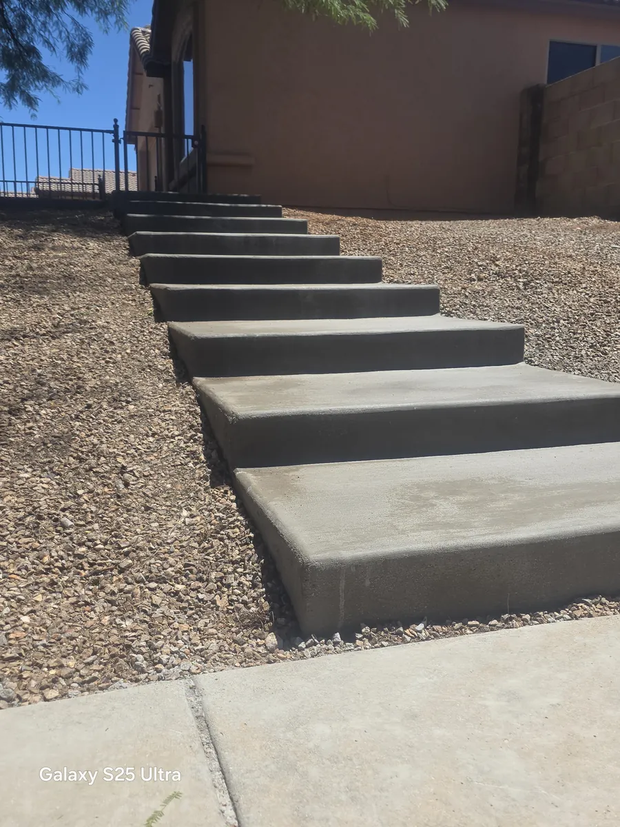 Concrete steps with an iron railing