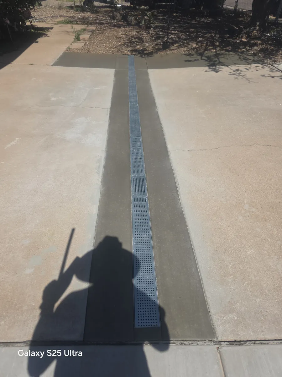 Concrete walkway with a linear trench drain