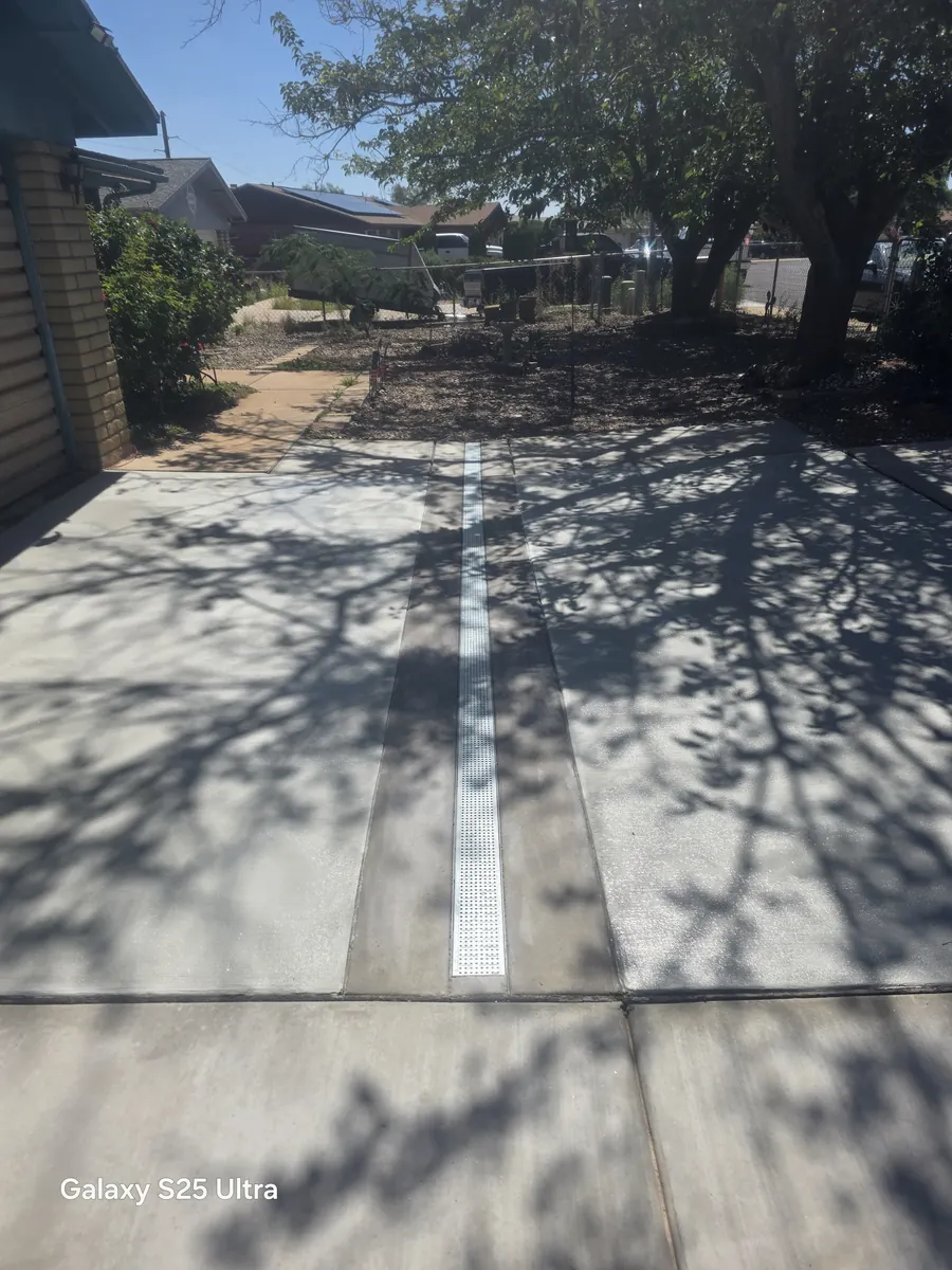 Shaded concrete walkway with drainage