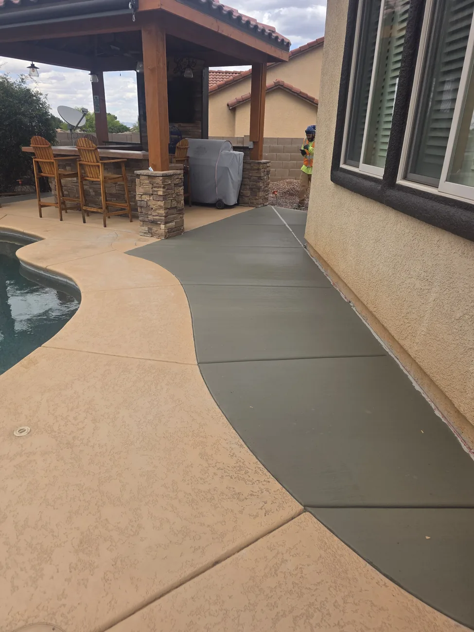 Stained concrete pool deck and walkway