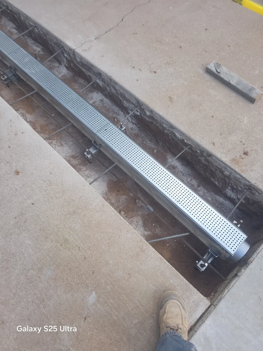 Channel drain set into finished concrete